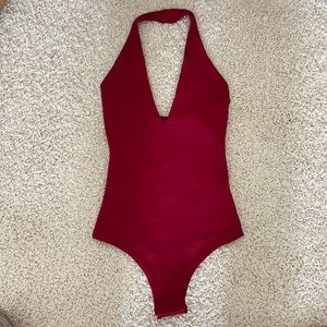 Red bodysuit.